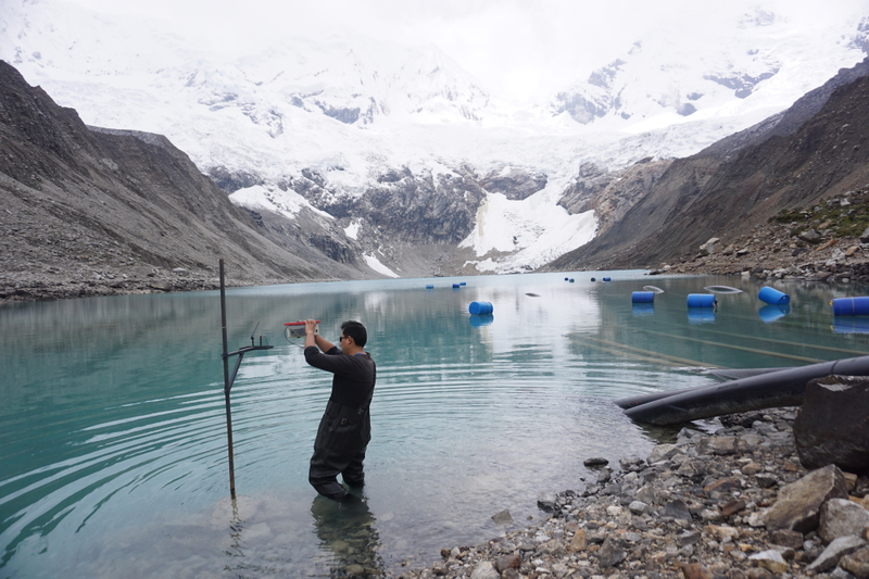 David Garay, a glaciologist from INAIGEM recovers data from instruments installed in Lake Palcacocha.
